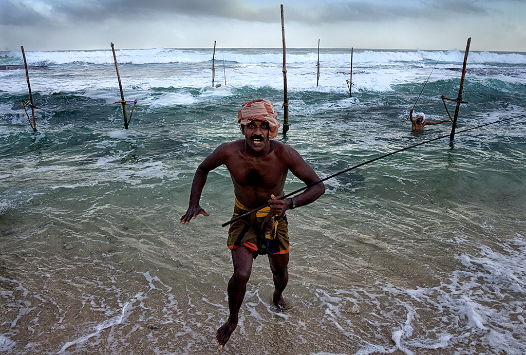 One of the fishermen coming onto the shore