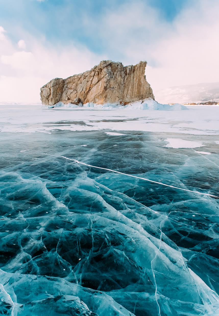 Turquoise gem like ice on the frozen lake
