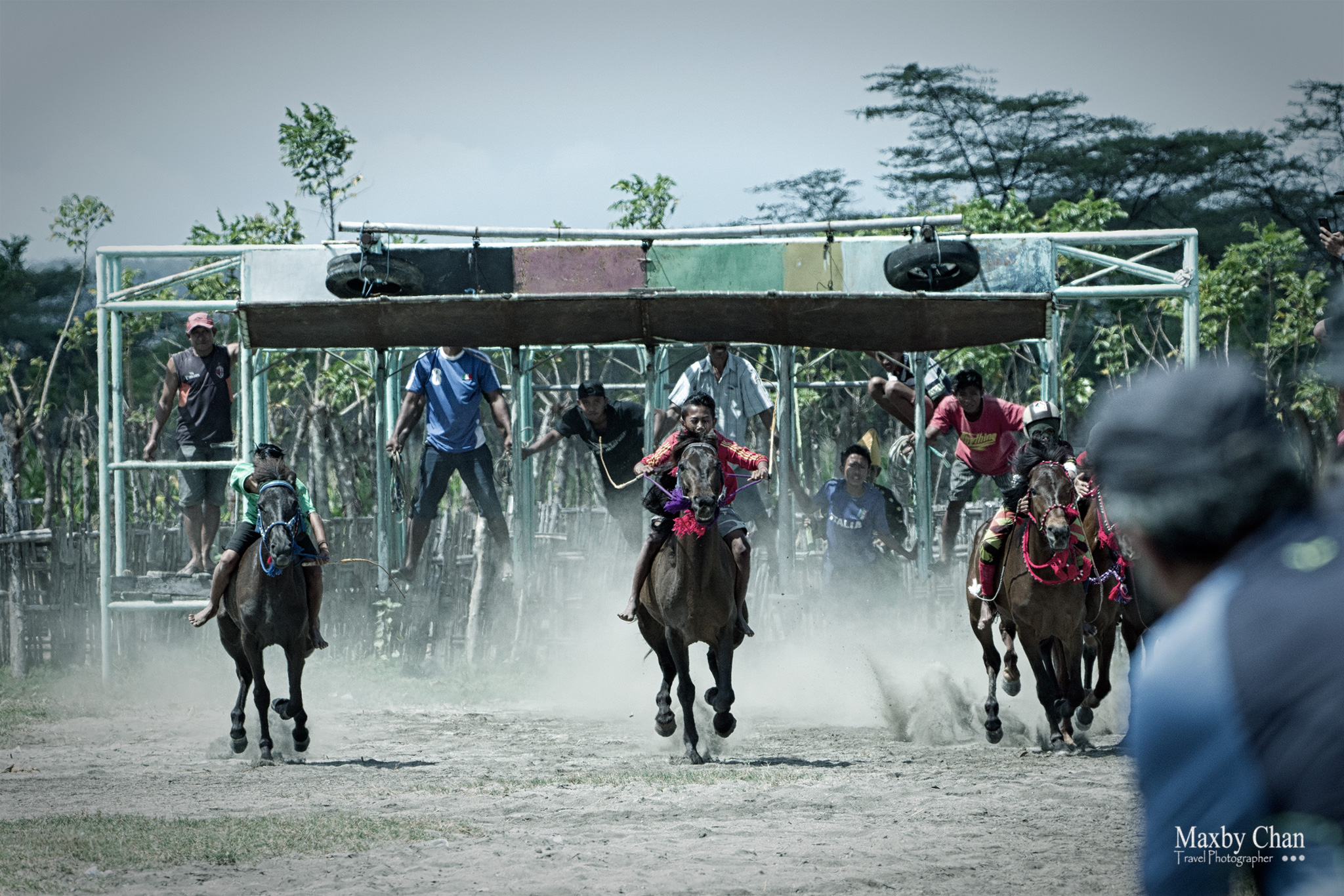 The start of the horse race at the gates.